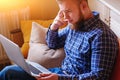 Young man working absorbed on laptop at home Royalty Free Stock Photo