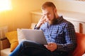 Young man working absorbed on laptop at home Royalty Free Stock Photo