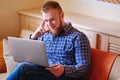 Young man working absorbed on laptop at home Royalty Free Stock Photo