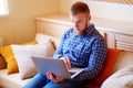 Young man working absorbed on laptop at home Royalty Free Stock Photo