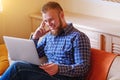 Young man working absorbed on laptop at home Royalty Free Stock Photo