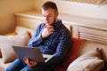 Young man working absorbed on laptop at home Royalty Free Stock Photo