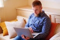 Young man working absorbed on laptop at home Royalty Free Stock Photo