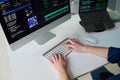 Young Man Coding Software on Desktop Computer in Office Setting Royalty Free Stock Photo
