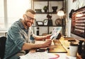 Young man working at computer at workplace