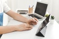 YOUNG MAN WORKING ON DESK AT HOME OFFICE BUSINESS