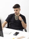 Young man working and drinking in his home office.education.business.e-commerce Royalty Free Stock Photo