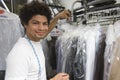 Young Man Working In Dry Cleaning Royalty Free Stock Photo