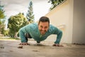 Young man working exercise on sidewalk. Royalty Free Stock Photo