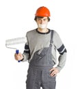 A young man in working grey clothes and orange hard helmet man with tape over mouth. Isolated on white background. Royalty Free Stock Photo