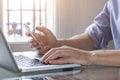 Young man working from home with laptop computer and smartphone Royalty Free Stock Photo