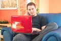 Young man working on laptop computer at home Royalty Free Stock Photo