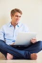 Young Man Working on Laptop Computer at Home Royalty Free Stock Photo