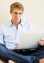 Young Man Working on Laptop Computer at Home Royalty Free Stock Photo