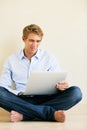 Young Man Working on Laptop Computer at Home Royalty Free Stock Photo