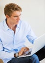 Young Man Working on Laptop Computer at Home Royalty Free Stock Photo