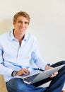 Young Man Working on Laptop Computer at Home Royalty Free Stock Photo