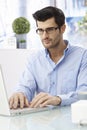 Young man working on laptop computer Royalty Free Stock Photo