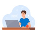 Young man working on laptop at home office. Freelancer at work, remote work. Young man sitting at a desk with a laptop and coffee Royalty Free Stock Photo