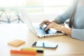 Young man working with laptop, man hands on notebook computer, business person at workplace Royalty Free Stock Photo