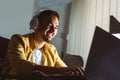 Man working late in the office. A man is sitting at a laptop in a dark office Royalty Free Stock Photo