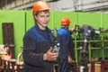 The young man working at the old factory on installation of equipment Royalty Free Stock Photo