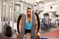 Young man working out with battle ropes at a gym Royalty Free Stock Photo