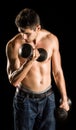 Young Man Working Out Biceps - Dumbbell Concentration Curl Royalty Free Stock Photo