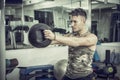 Young man working out in gym with kettlebells Royalty Free Stock Photo