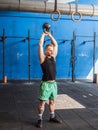 Young man exercising with kettlebells in gym Royalty Free Stock Photo