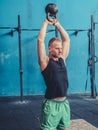 Young man exercising with kettlebells in gym Royalty Free Stock Photo
