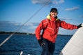 Young man working on sailing ship, active lifestyle, summer sport concept Royalty Free Stock Photo