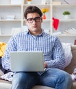 Young man working studying in messy room Royalty Free Stock Photo