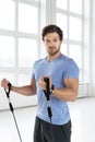 Young man during workout with a resistance bands in the gym Royalty Free Stock Photo