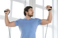 Young man during workout with a resistance bands in the gym Royalty Free Stock Photo