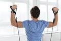 Young man during workout with a resistance bands in the gym Royalty Free Stock Photo