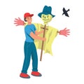 A young man works in the garden, the farmer sets up a Scarecrow from birds. Flat cartoon vector Royalty Free Stock Photo