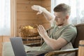 Young man works with laptop in country house Royalty Free Stock Photo