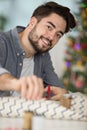 young man wrapping christmas present Royalty Free Stock Photo