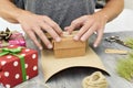 Young man wrapping a gift