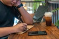 Young man writing notes indoor Royalty Free Stock Photo