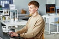Young man writing programming code on computer Royalty Free Stock Photo