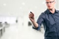 Young man writing something with marker in the office Royalty Free Stock Photo