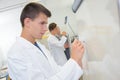 Young man writing on whiteboard Royalty Free Stock Photo