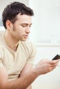 Young man writting SMS Royalty Free Stock Photo