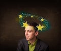 Young man with yellow stars circleing around his head Royalty Free Stock Photo