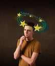 Young man with yellow stars circleing around his head Royalty Free Stock Photo