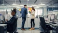 Young Manager Creating Project Plan with Experienced Colleague on Office Wall with Paper Notes