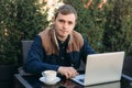 The young manager working on a laptop in the park. Lunch Break Royalty Free Stock Photo