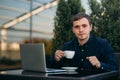 The young manager working on a laptop in the park. Lunch Break. Royalty Free Stock Photo